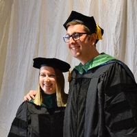 Two students taking picture at GradFest